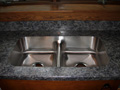 Stainless undermount sink in laminate.